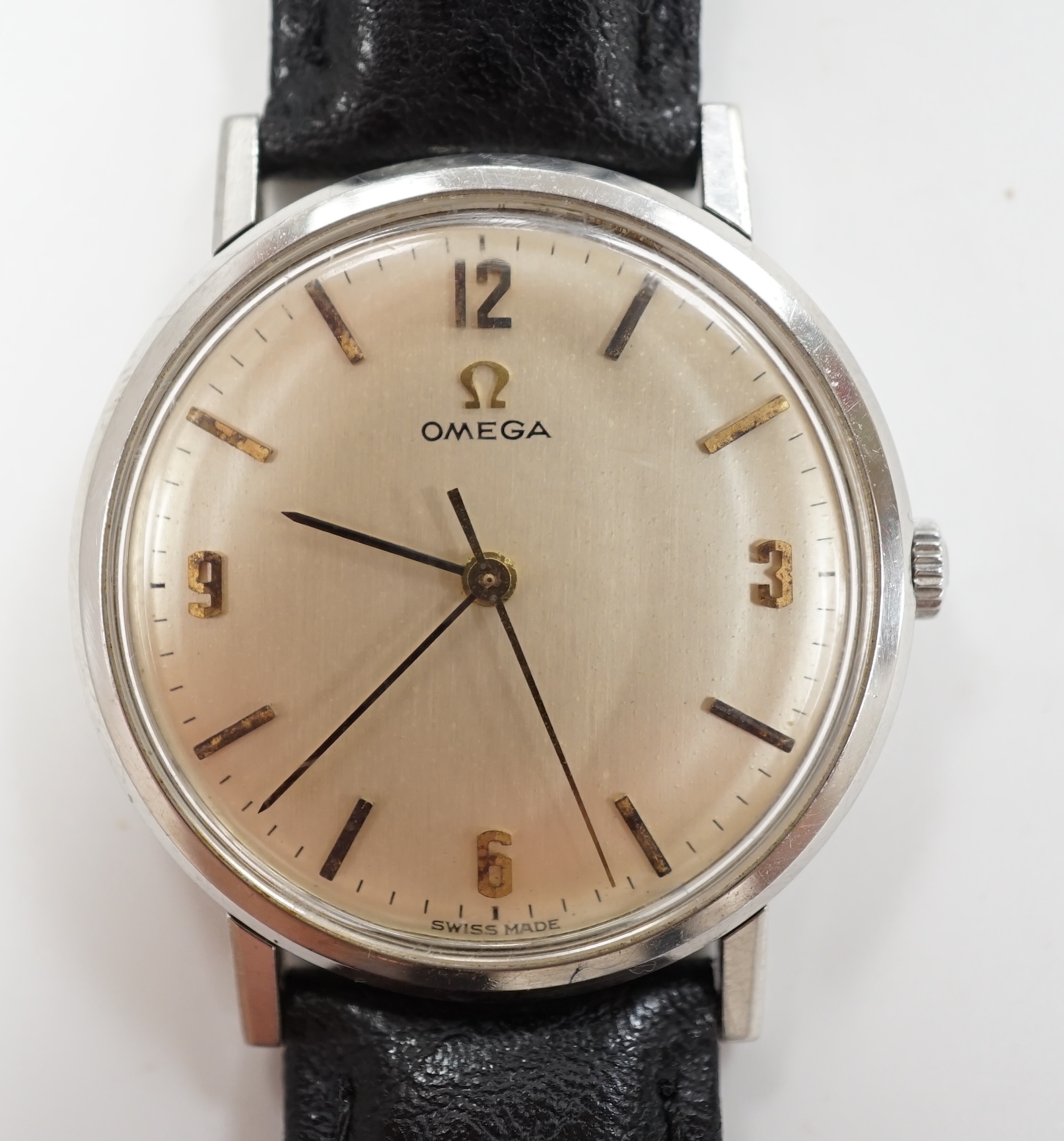 A gentleman's late 1960's stainless steel Omega manual wind wrist watch, with baton and quarterly Arabic numerals, case diameter 34mm, on later associated leather strap, with Omega box.